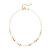 Collana corta perle, elementi rigati e boule Tarocchi